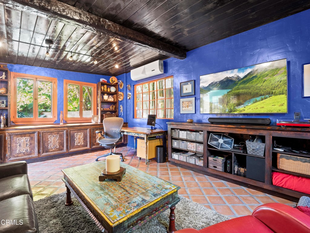 1505 Carroll Drive Altadena, CA 91001 - Photo 21 of 40 a living room with furniture a flat screen tv and floor to ceiling window