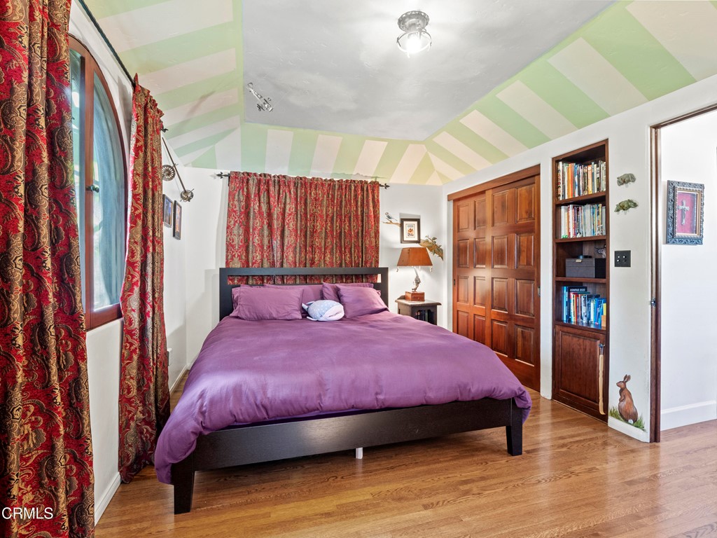 1505 Carroll Drive Altadena, CA 91001 - Photo 28 of 40 a bedroom with a bed and a book shelf