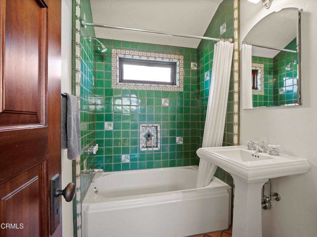 1505 Carroll Drive Altadena, CA 91001 - Photo 29 of 40 a bathroom with a sink a mirror a bathtub and shower
