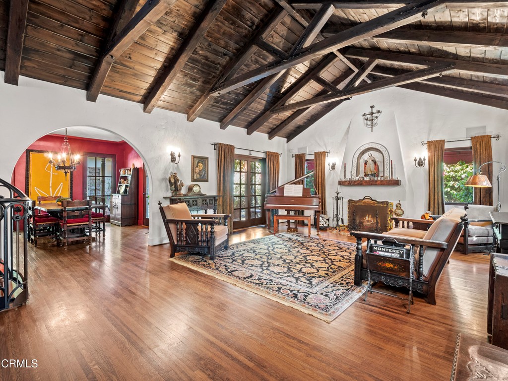 1505 Carroll Drive Altadena, CA 91001 - Photo 4 of 40 a living room with fireplace furniture and a chandelier