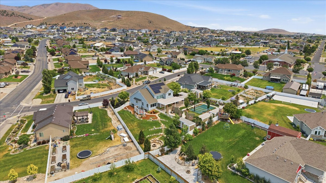 2038 East Ranch Road Eagle Mountain, UT 84005 - Photo 64 of 66 Expansive neighborhood featuring numerous residential properties and mountainous terrain