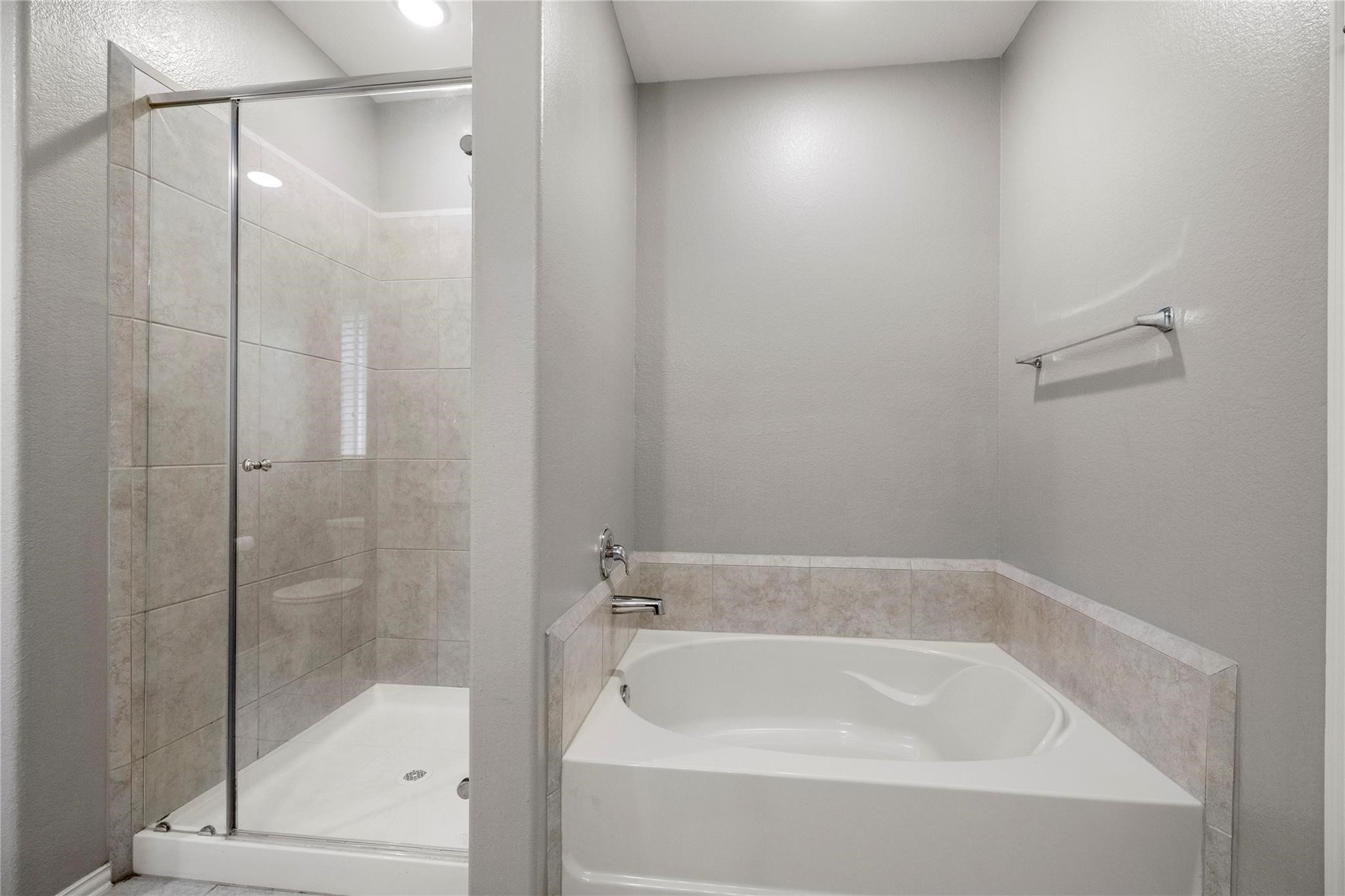 29507 Whitebrush Trace Drive Spring, TX 77386 - Photo 13 of 32 Primary bathroom with soaking tub and separate shower.