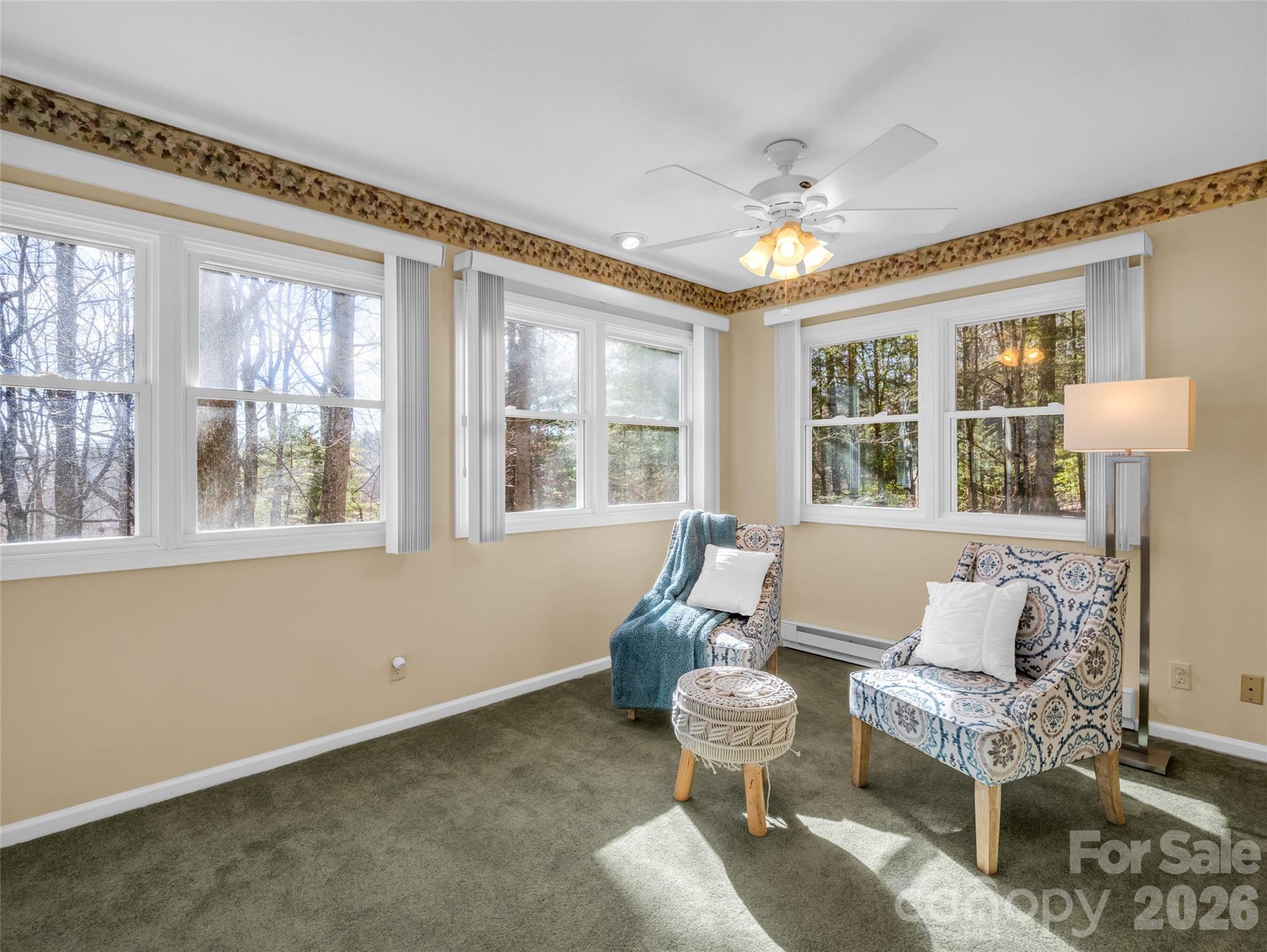 1594 Indian Cave Road Hendersonville, NC 28739 - Photo 24 of 48 a living room with furniture and a large window