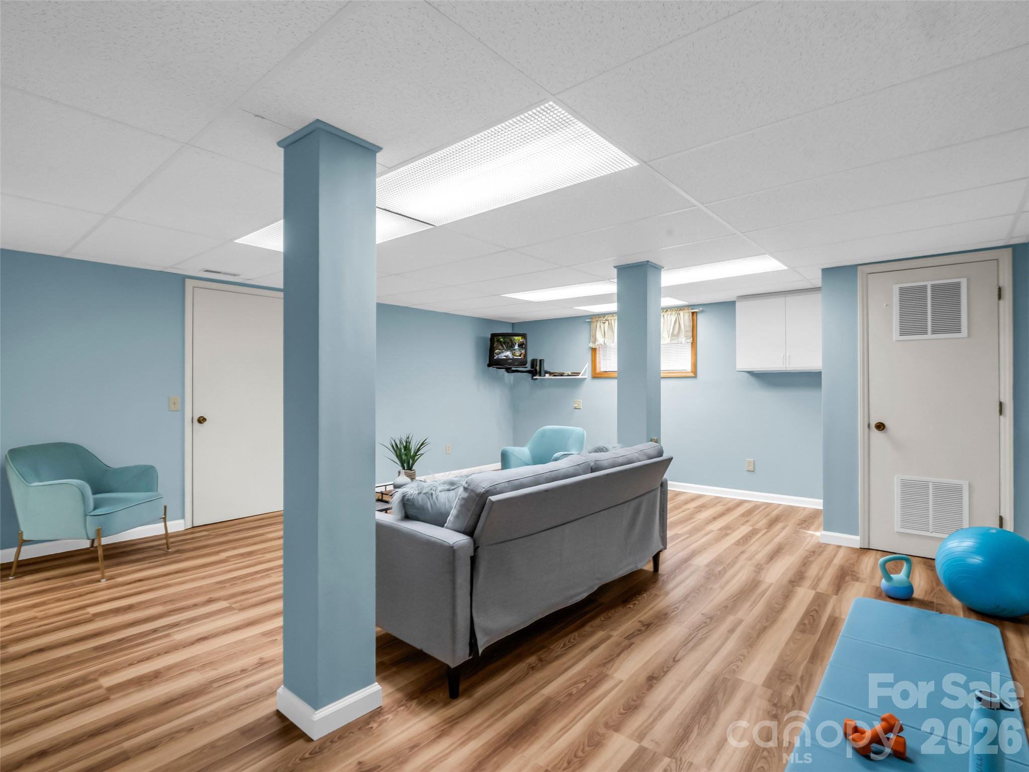 1594 Indian Cave Road Hendersonville, NC 28739 - Photo 33 of 48 a living room with furniture and a wooden floor