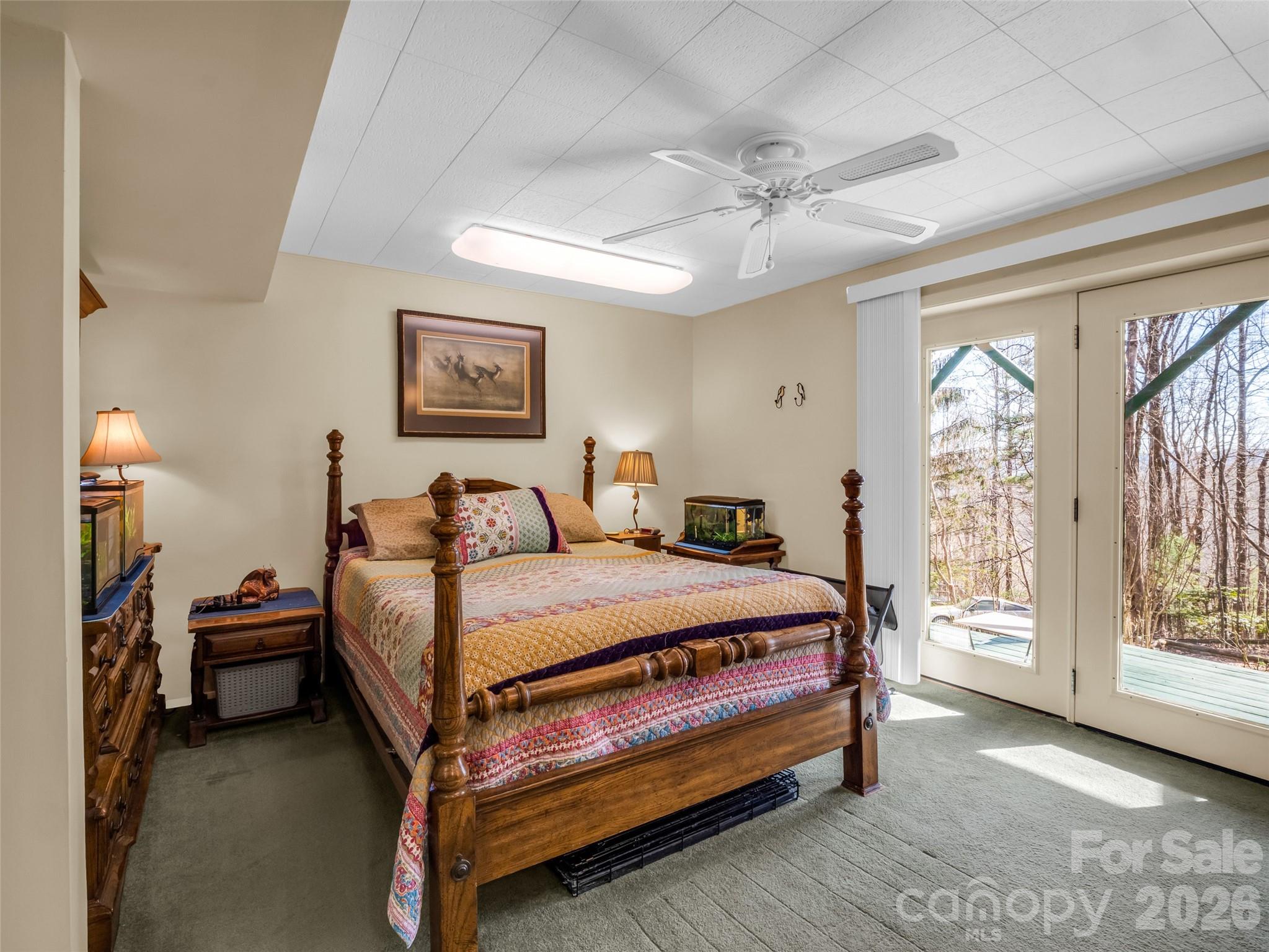 1594 Indian Cave Road Hendersonville, NC 28739 - Photo 37 of 48 a bed room with a bed and a lamp