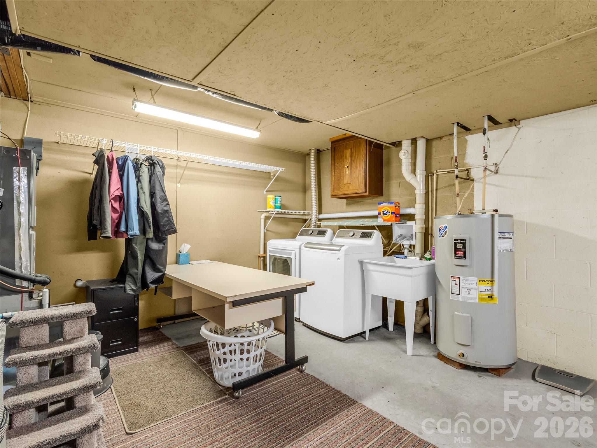 1594 Indian Cave Road Hendersonville, NC 28739 - Photo 42 of 48 a room with white cabinets and wooden chairs