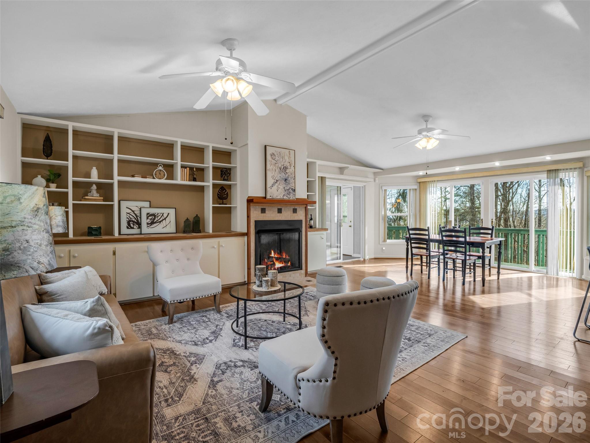 1594 Indian Cave Road Hendersonville, NC 28739 - Photo 9 of 48 a living room with fireplace furniture and a large window