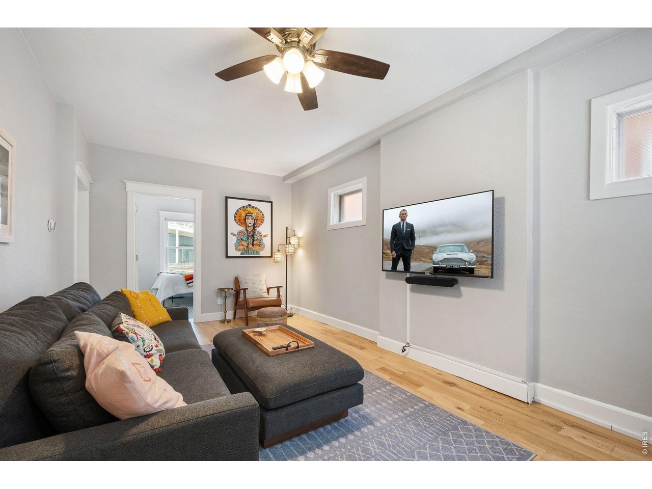 a living room with furniture and a flat screen tv