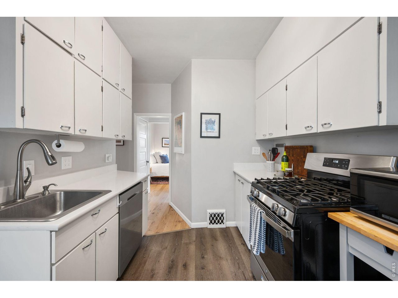 1070 Cook Street Denver, CO 80206 - Photo 11 of 35 a kitchen that has a sink and a stove