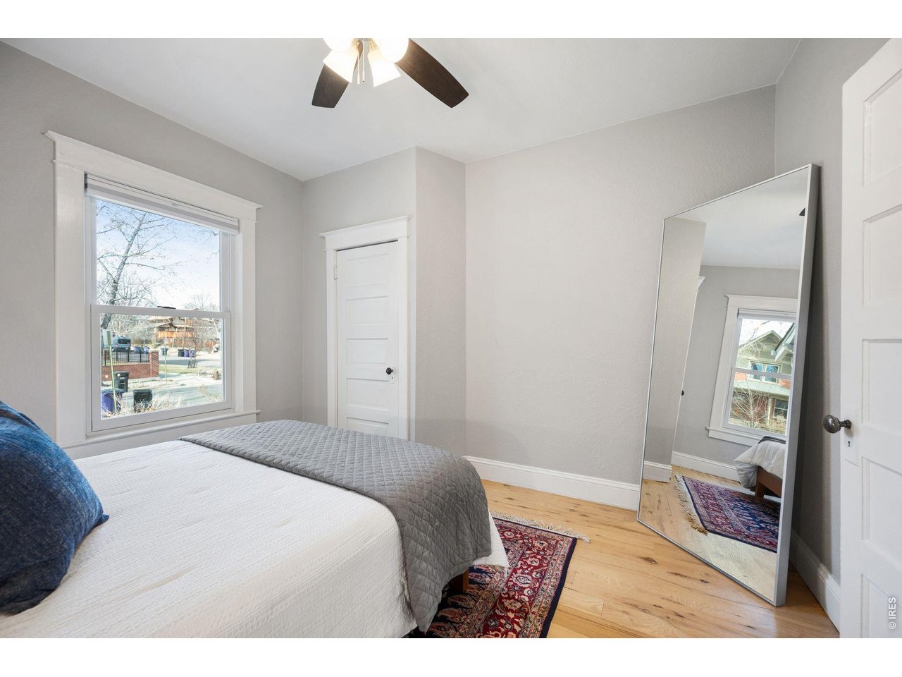 1070 Cook Street Denver, CO 80206 - Photo 16 of 35 a bedroom with a bed and a window