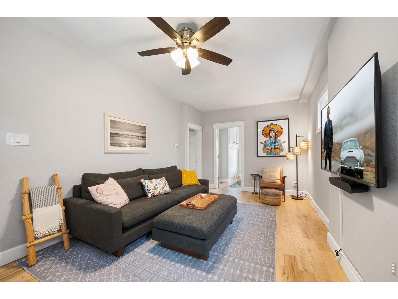 1070 Cook Street Denver, CO 80206 - Photo 6 of 35 a living room with furniture and a flat screen tv