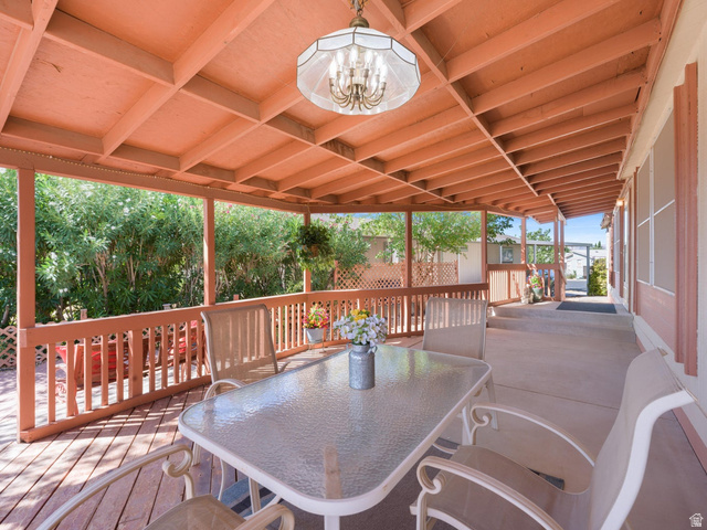 3941 West 40 North Hurricane, UT 84737 - Photo 41 of 55 Covered outdoor living space featuring a wood-finish ceiling, exposed beams, and a chandelier-style light fixture