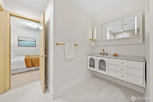 a utility room with cabinets washer and dryer