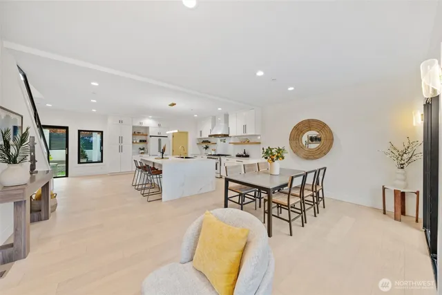 a living room with furniture and kitchen view