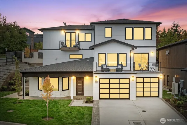 a view of a house with a yard and balcony