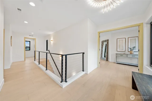 a view of a hallway with windows