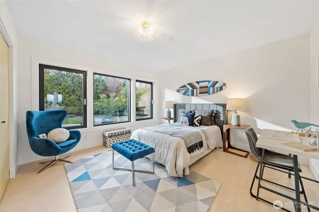 a bed room with a bed and a window