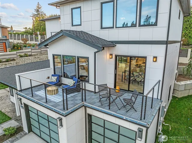 a view of house with outdoor seating area