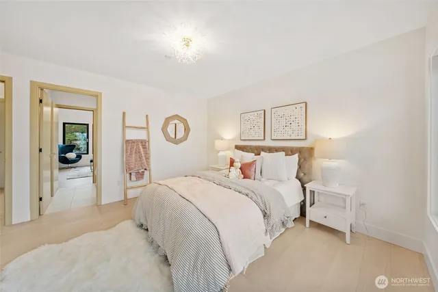 a bedroom with a bed and a lamp