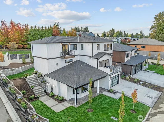 an aerial view of a house with table and chairs