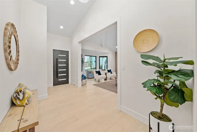 a view of living room with furniture and a potted plant