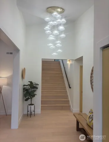 a view of a livingroom with furniture and a potted plant