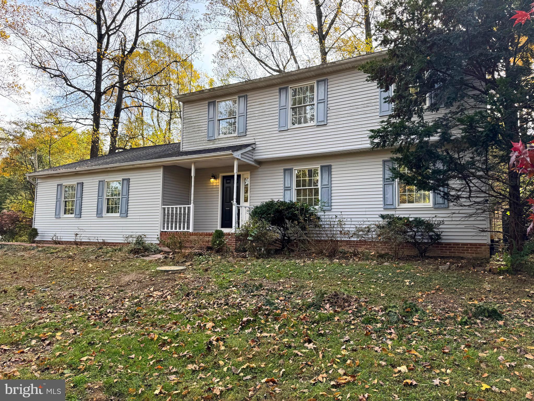 200 Mountain Road Lewisberry, PA 17339 - Photo 1 of 31 a house that has a lot of plants and trees in front of it