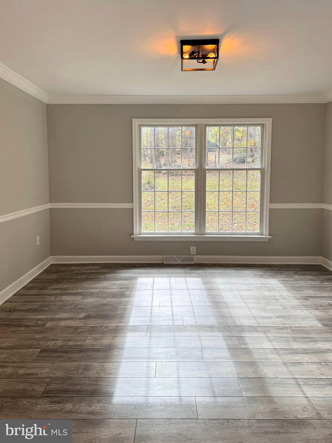 200 Mountain Road Lewisberry, PA 17339 - Photo 9 of 31 an empty room with wooden floor and windows