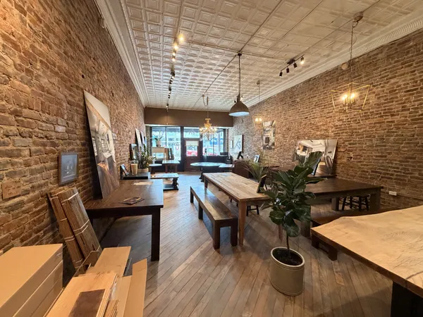 a view of a patio with chairs and potted plants
