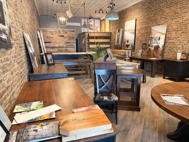 a living room with chairs and a wooden floor