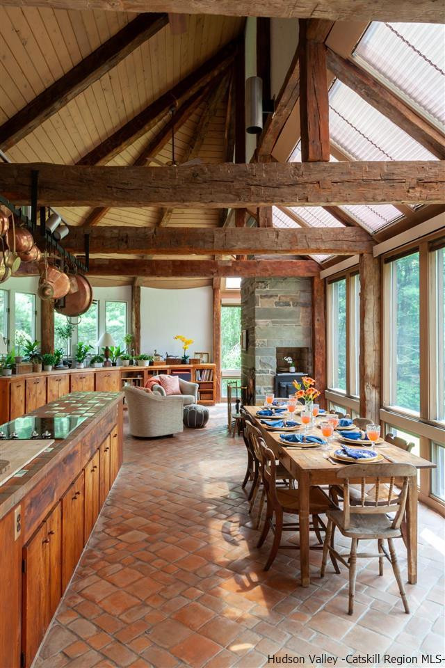 347 Old Powdermill Road Saugerties, NY 12477 - Photo 16 of 35 a view of a patio with dining table and chairs with wooden floor