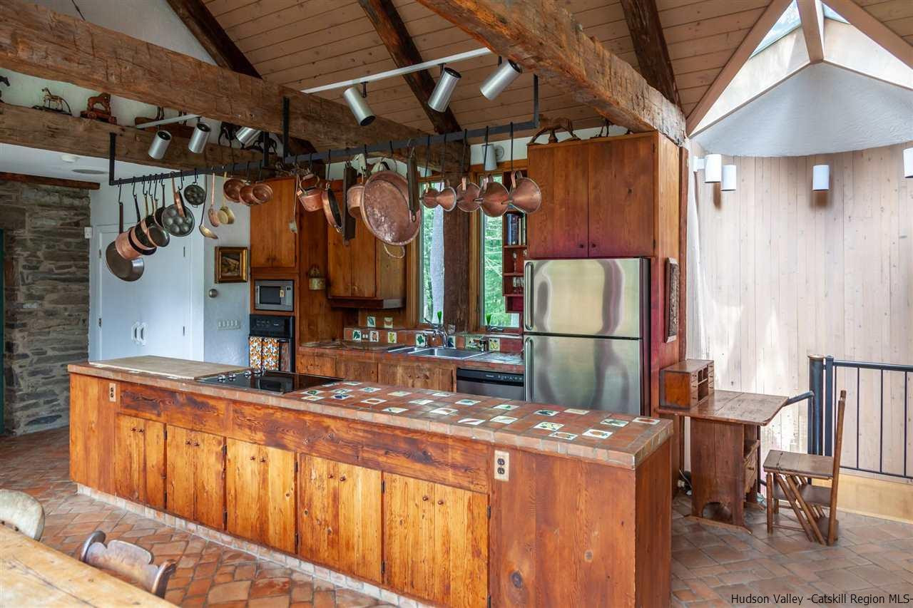 347 Old Powdermill Road Saugerties, NY 12477 - Photo 19 of 35 a kitchen with a refrigerator and a stove