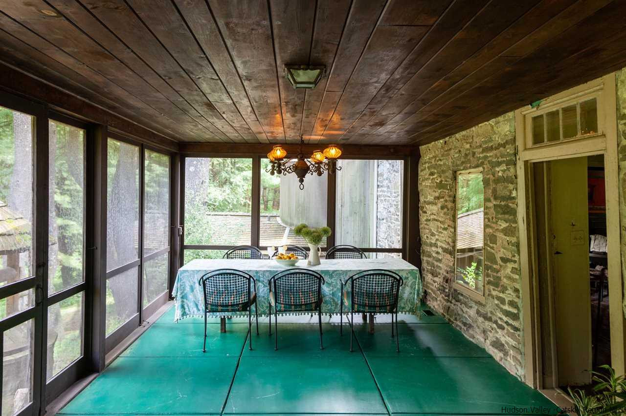 347 Old Powdermill Road Saugerties, NY 12477 - Photo 21 of 35 a view of a dining room with furniture window and outside view