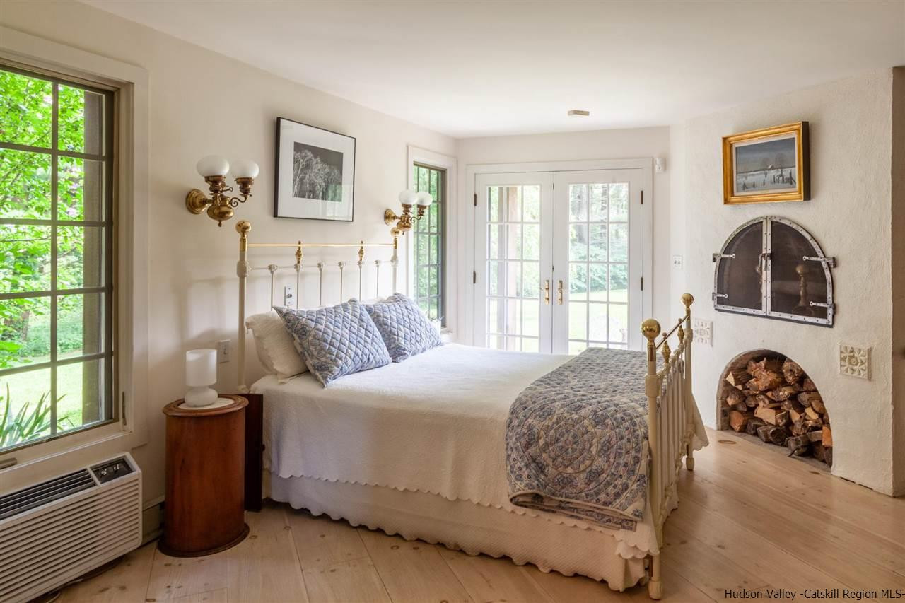 347 Old Powdermill Road Saugerties, NY 12477 - Photo 23 of 35 a bedroom with a bed couch and a window