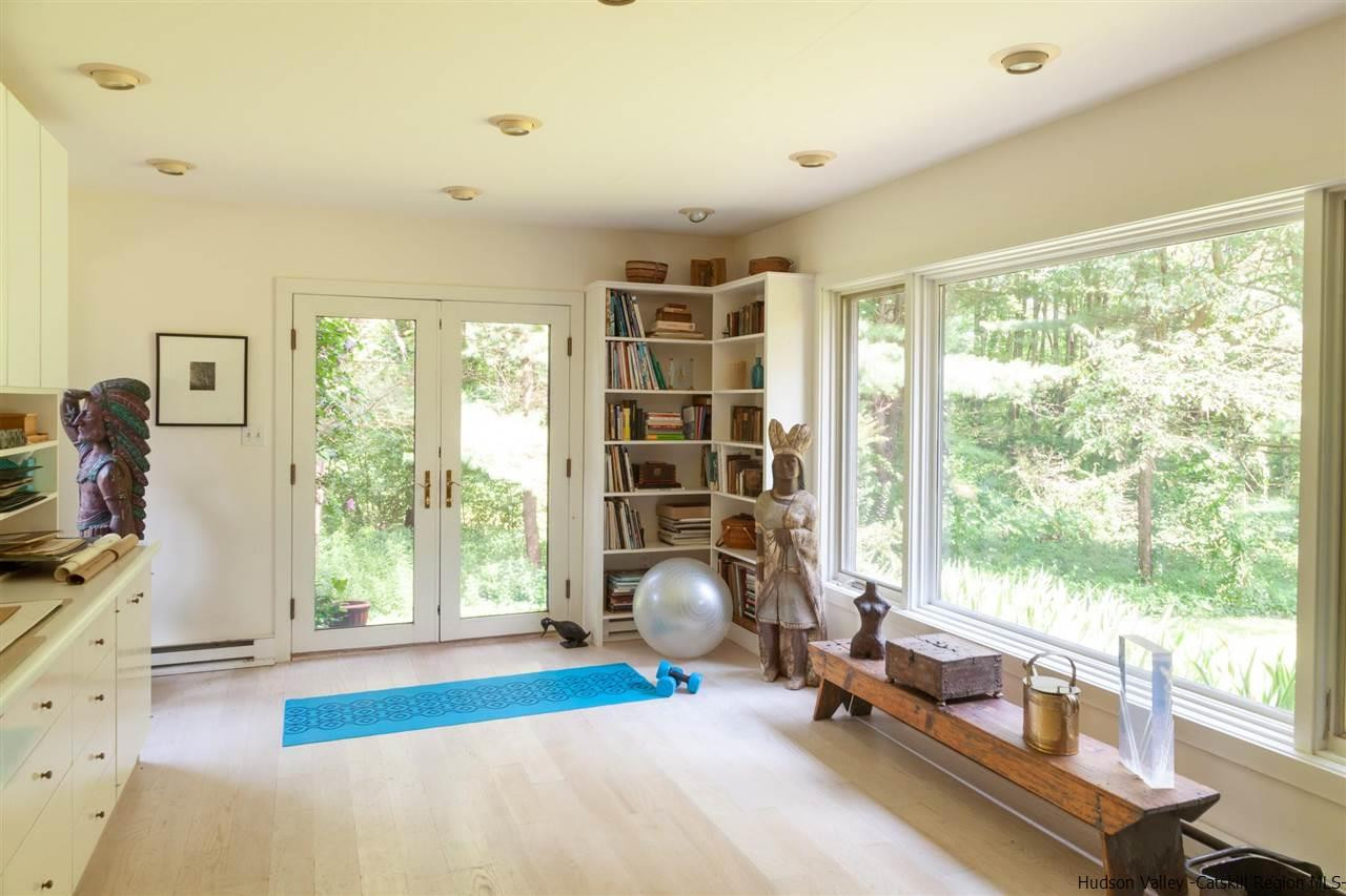 347 Old Powdermill Road Saugerties, NY 12477 - Photo 25 of 35 a living room with fireplace furniture and a large window