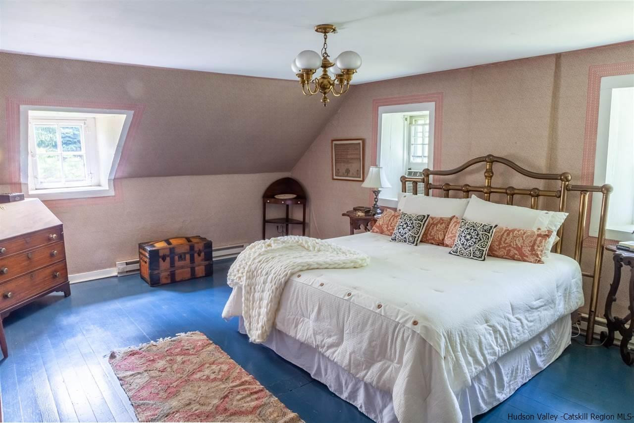 347 Old Powdermill Road Saugerties, NY 12477 - Photo 26 of 35 a bedroom with bed and a chandelier
