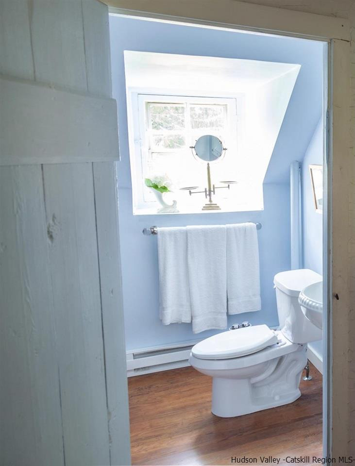 347 Old Powdermill Road Saugerties, NY 12477 - Photo 27 of 35 a white toilet sitting next to a bathroom sink