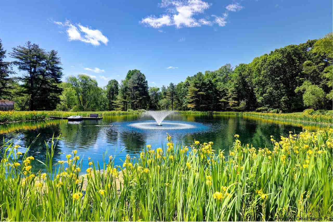 347 Old Powdermill Road Saugerties, NY 12477 - Photo 30 of 35 a view of a lake with a building in the background