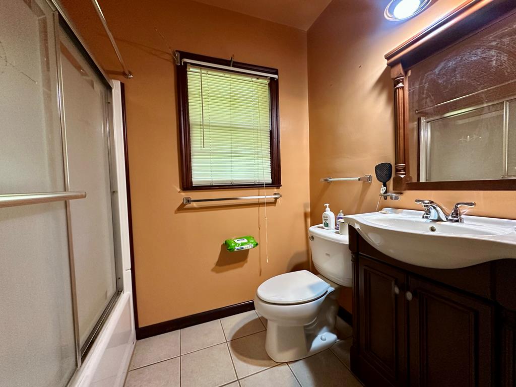 3042 Colonial Drive Columbus, GA 31903 - Photo 22 of 29 a bathroom with a sink toilet and mirror