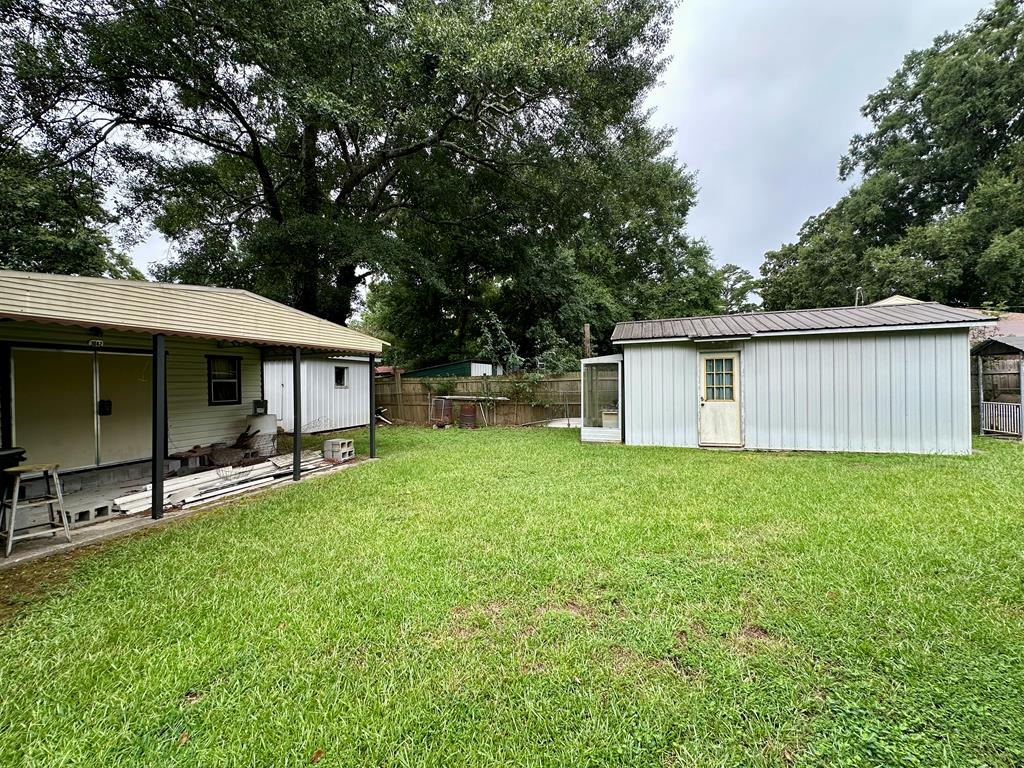 3042 Colonial Drive Columbus, GA 31903 - Photo 27 of 29 a view of a house with backyard and a garden