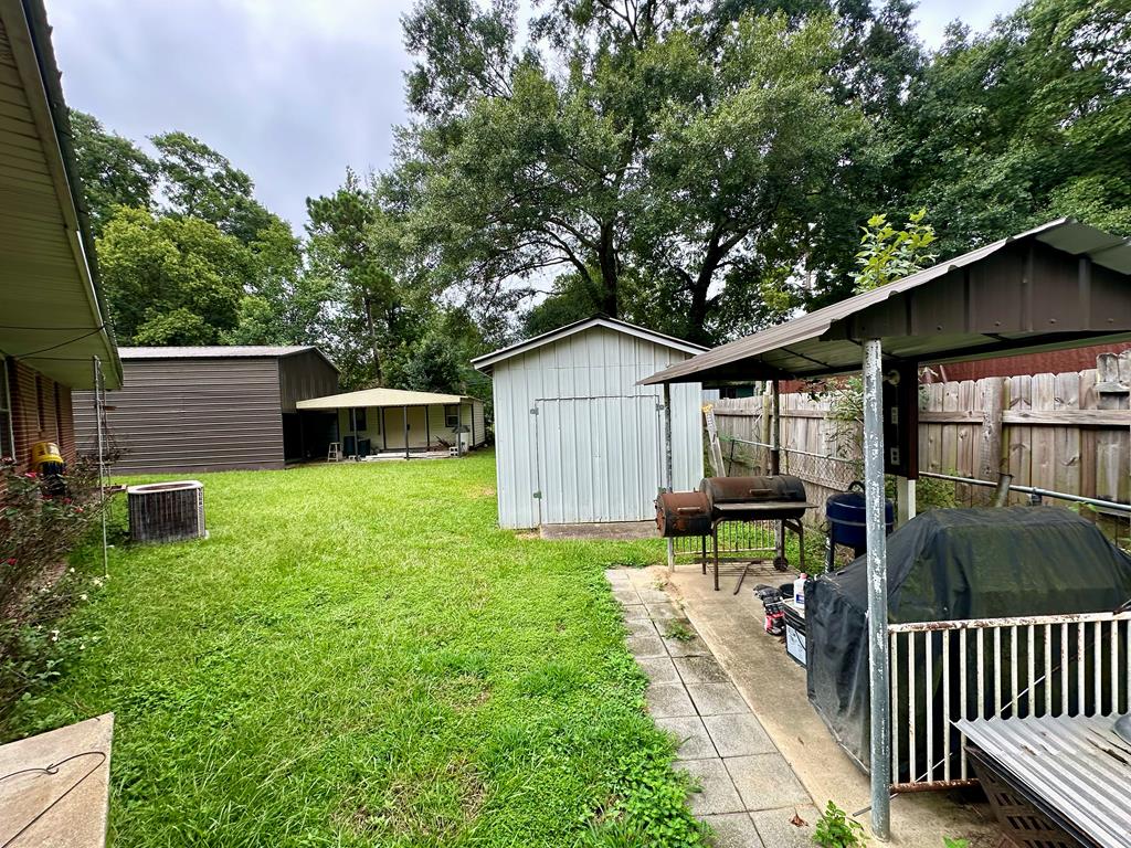 3042 Colonial Drive Columbus, GA 31903 - Photo 29 of 29 a view of a house with backyard and sitting area