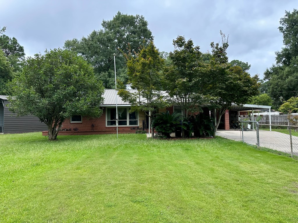 3042 Colonial Drive Columbus, GA 31903 - Photo 3 of 29 a table and chairs in the garden
