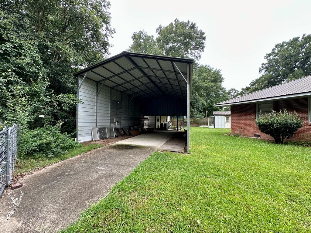 3042 Colonial Drive Columbus, GA 31903 - Photo 6 of 29 a view of a house with a back yard
