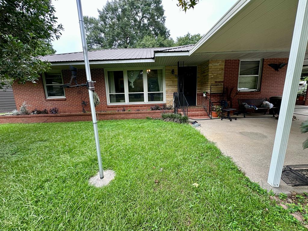 3042 Colonial Drive Columbus, GA 31903 - Photo 8 of 29 a view of a house with backyard sitting area and porch