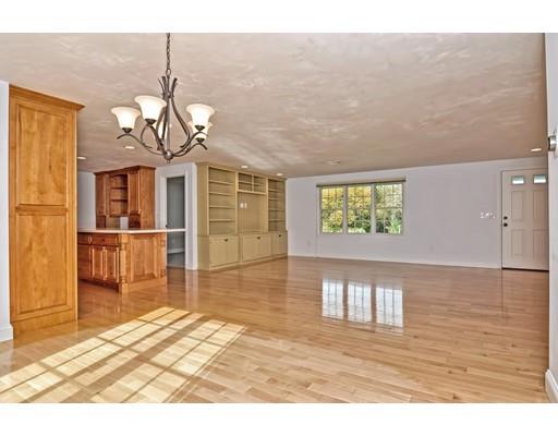 11 Great Bend Road Sandwich, MA 02537 - Photo 11 of 30 a view of a livingroom with wooden floor and chandelier