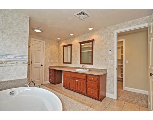 11 Great Bend Road Sandwich, MA 02537 - Photo 20 of 30 a spacious bathroom with a granite countertop double vanity sink a mirror and a bathtub