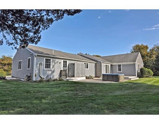 11 Great Bend Road Sandwich, MA 02537 - Photo 8 of 30 a front view of a house with a garden and trees
