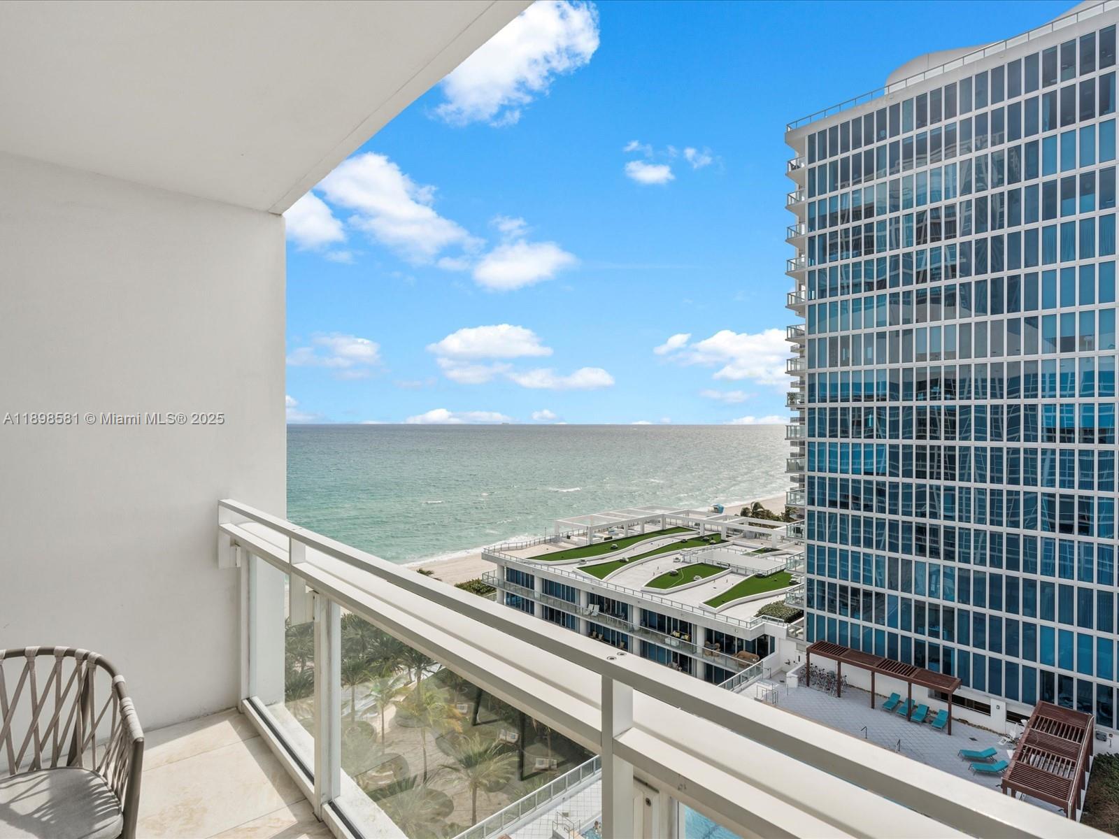 6801 Collins Avenue, Unit 1402 Miami Beach, FL 33141 - Photo 37 of 50 a view of a balcony with a floor to ceiling window