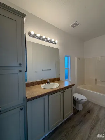 a bathroom with a sink and a toilet