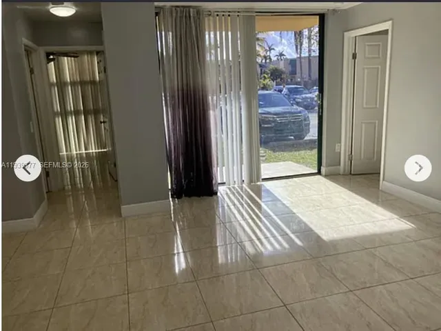 a view of an entryway with a door